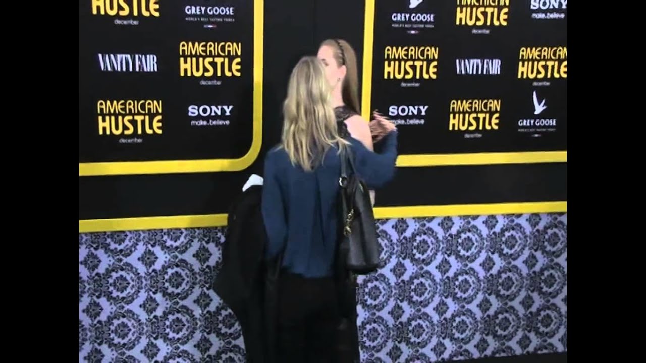 American Hustle stars Jeremy Renner and Amy Adams are greeted with much zeal by pho