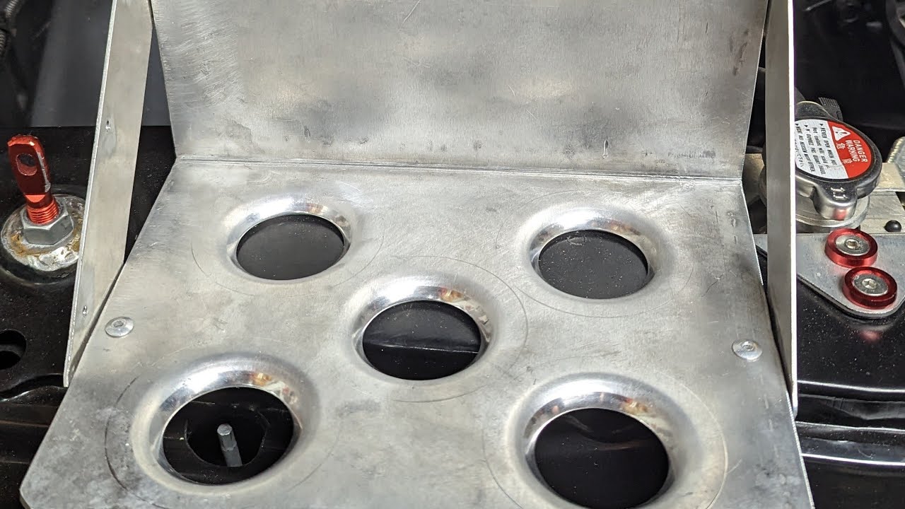 Custom battery tray relocation for the OBS project Smog Legal