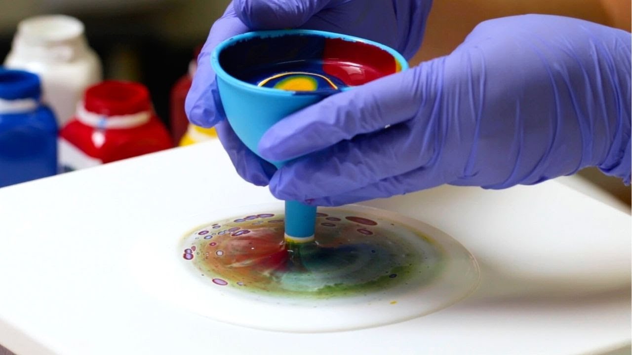 Funnel pour! Primary color acrylic pour with a funnel on a spinner