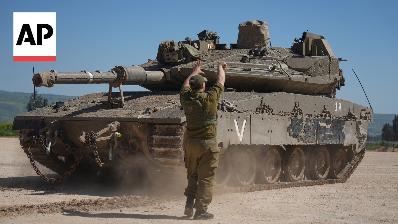 Israeli tanks move to Lebanon border as Israel strikes the country