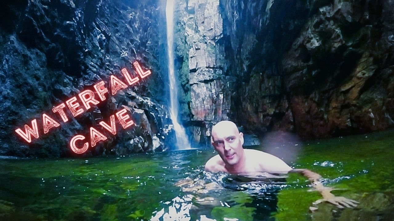 Swimming through a waterfall into a cave - Elands River Trail. (#15)