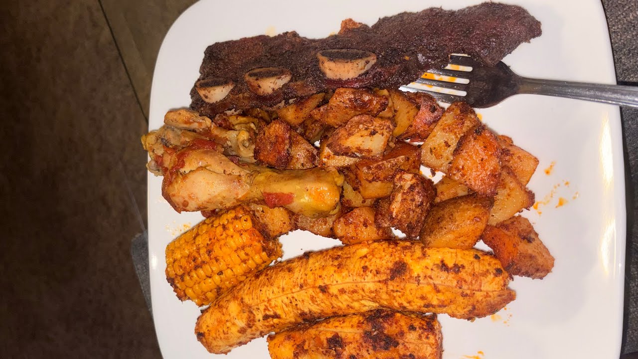 Baked potatoes, plantain,corn with chicken/Ribs 