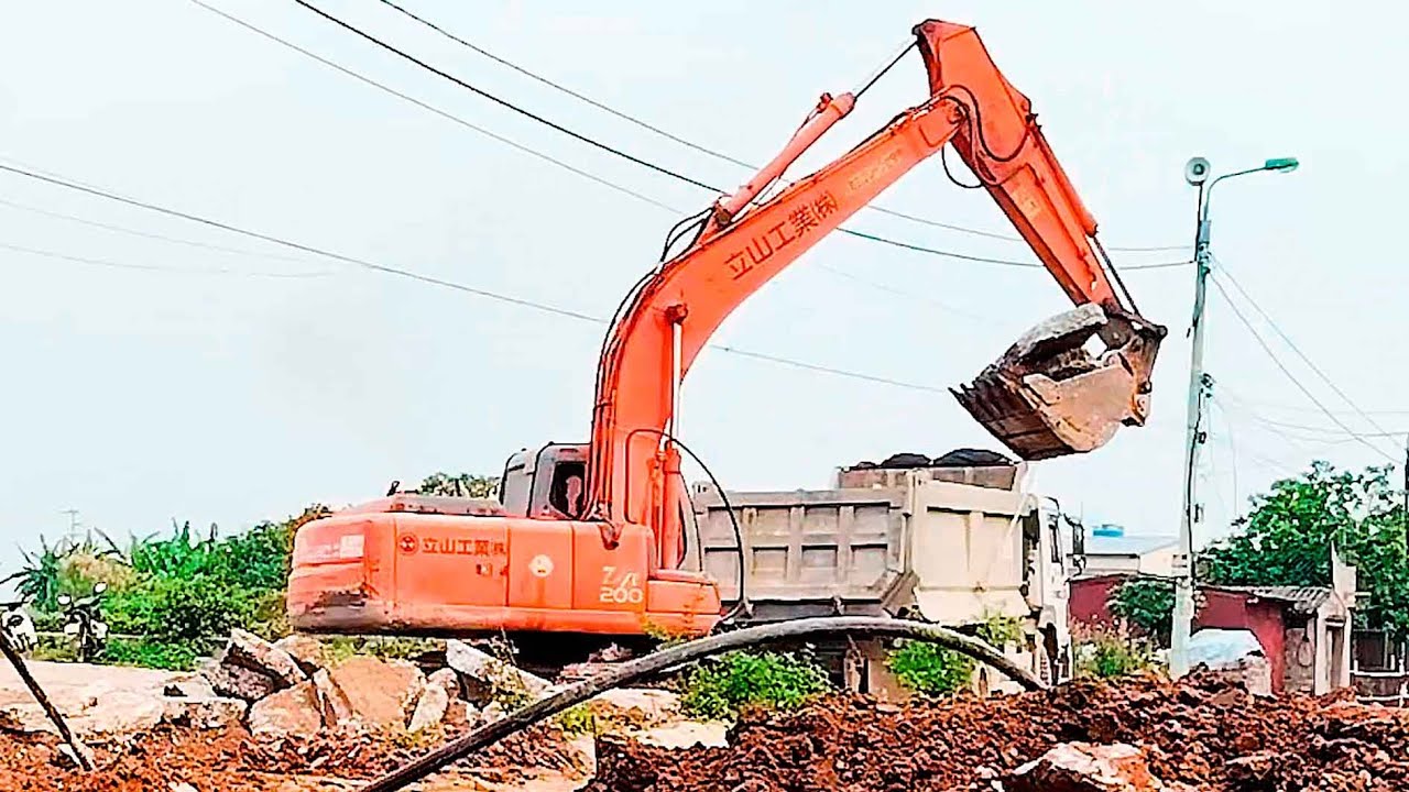 The latest approved project: Hitachi excavator loading concrete onto truck.