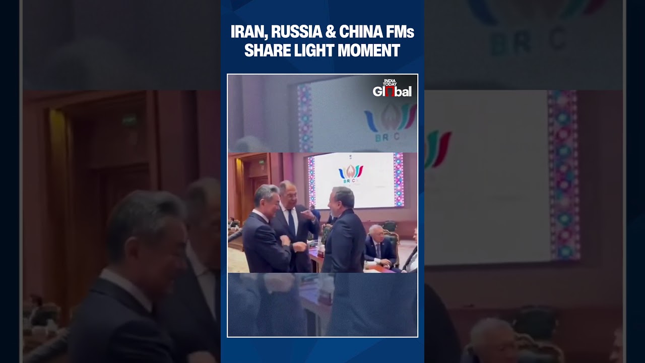 Chinese Foreign Minister Wang Yi Takes Interest In Map-Of-Iran Sticker On Abbas Araghchi Coat
