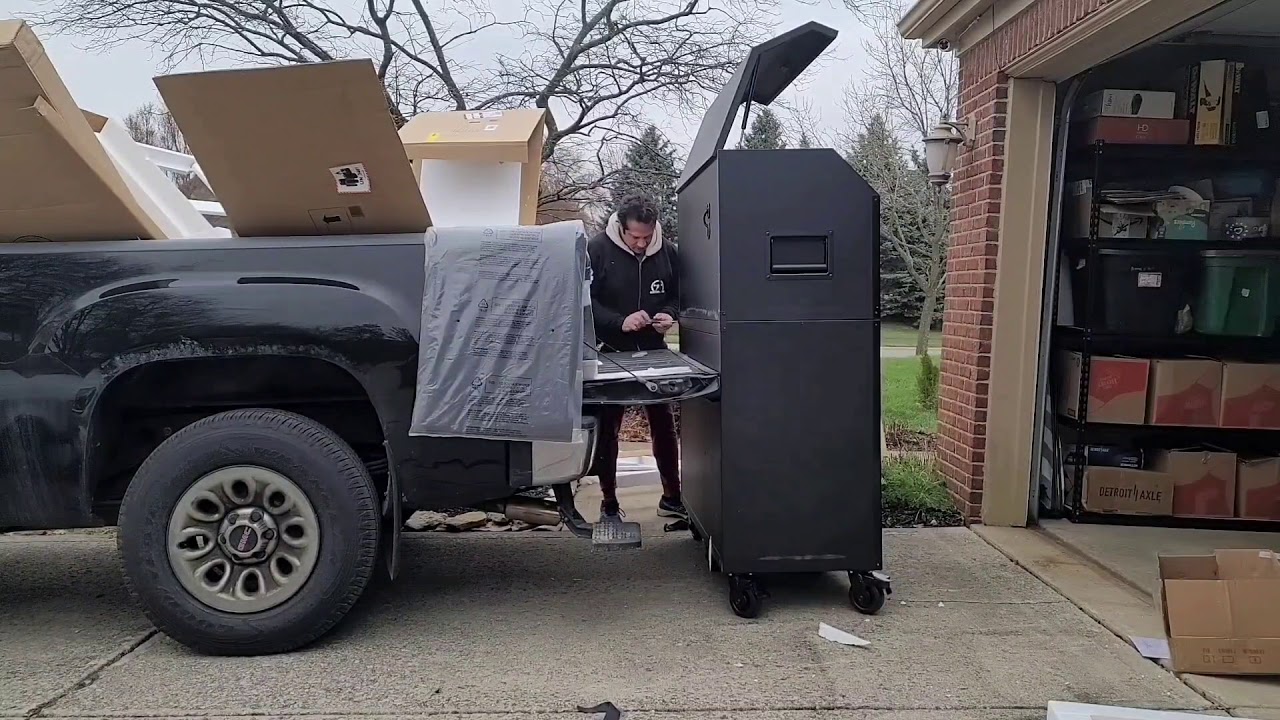 unloading a 700lb husky tool box from a truck
