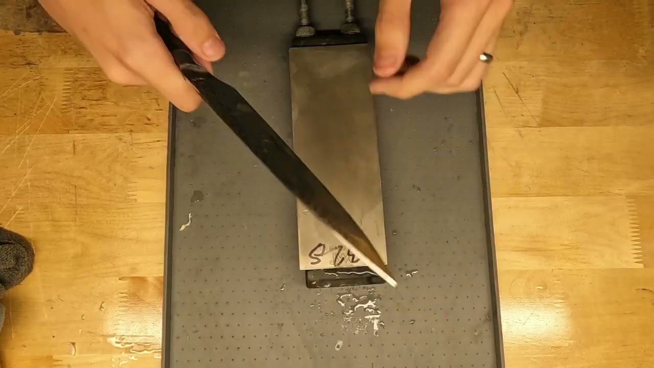 Small chip repair and sharpening on a kitchen knife!