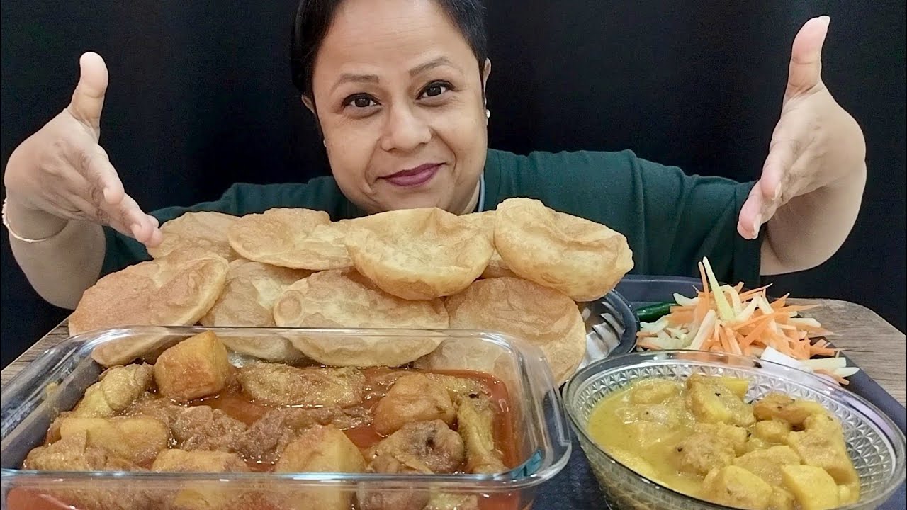 Sunday special lunch, puri, chicken curry and dum alu