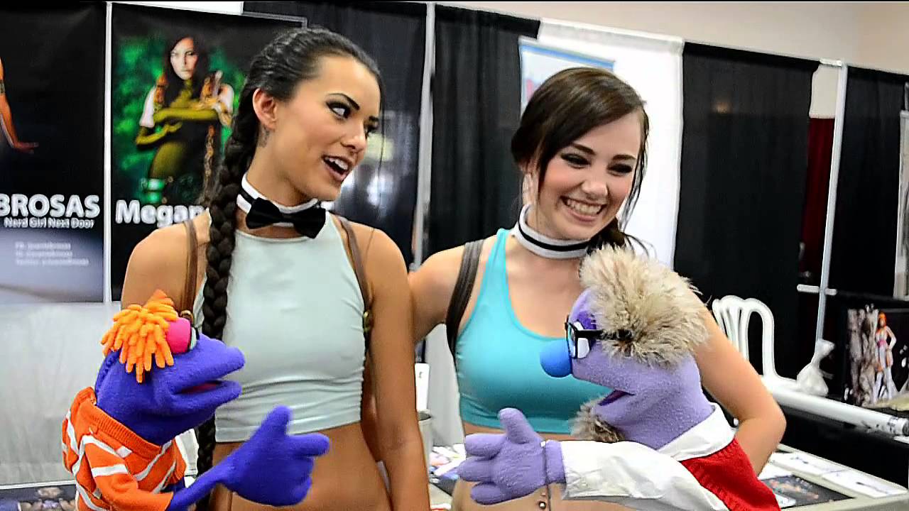 Cosplayers Joanie Brosas and Megan Golden talk to two new fans at C4 in Ventura.