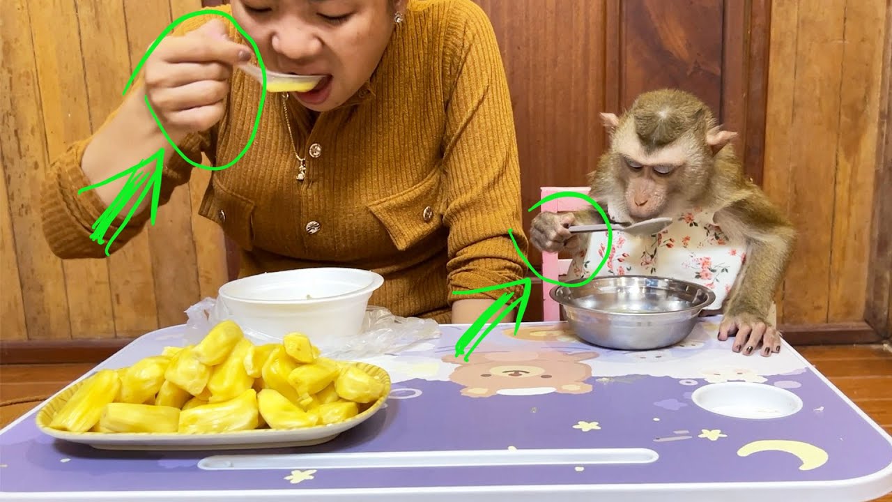 Mom & Judee Holding Spoon The Same Style Having Meal