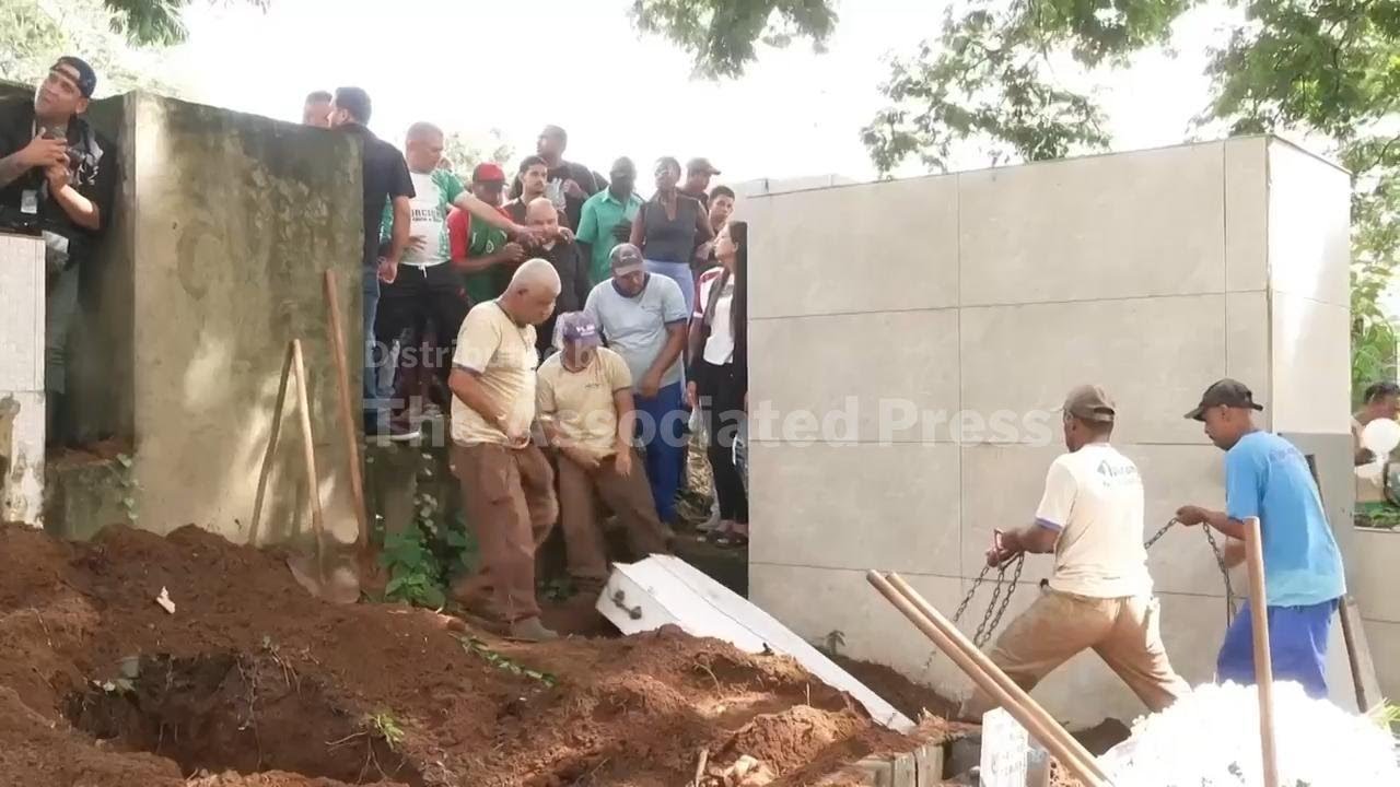Families of flood victims in southeastern Brazil begin burying their dead