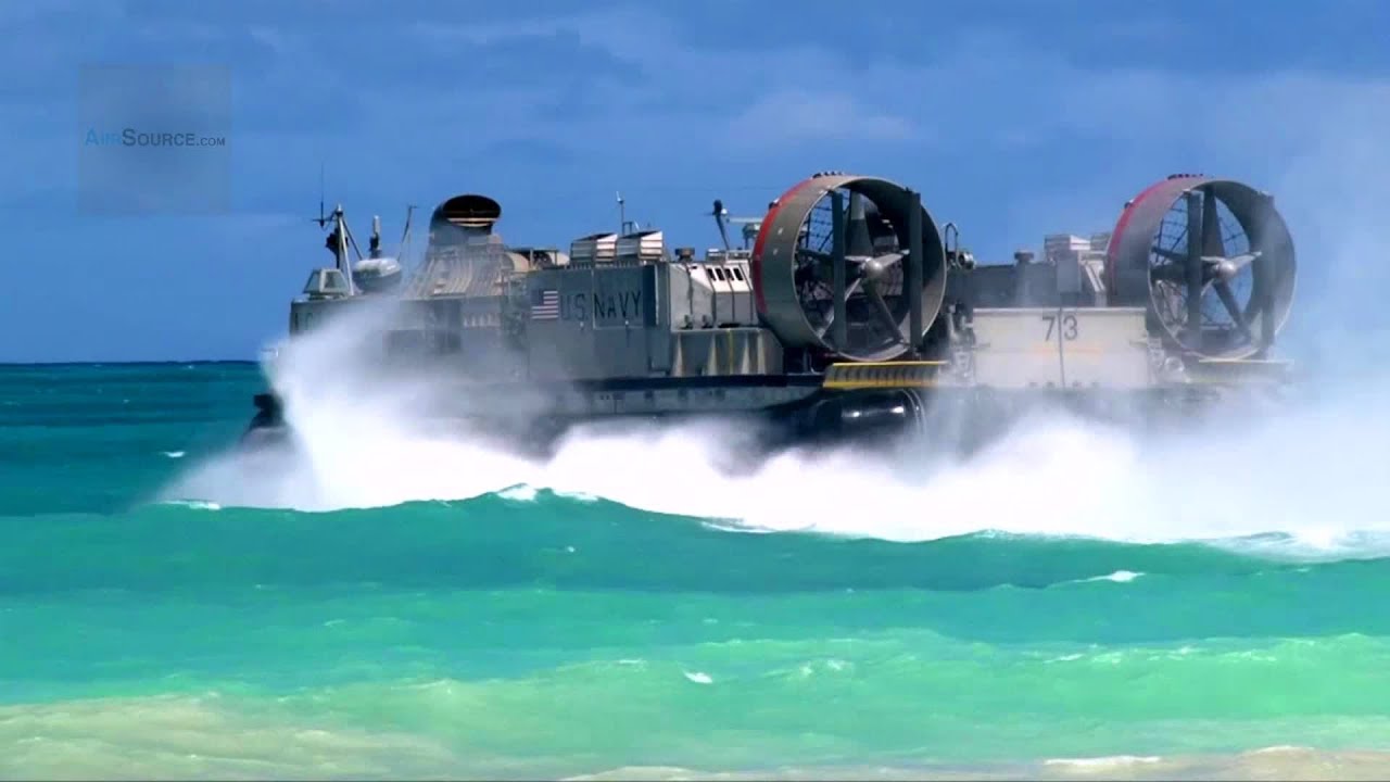 US Navy LCAC Hovercraft Land on Beach, Unload Equipment, Return to Aircraft Carrier
