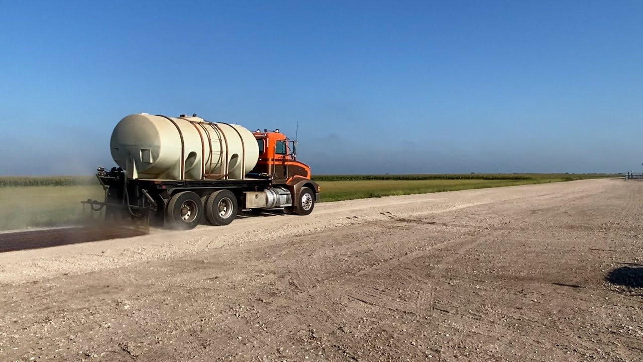 Soybean oil used for dust control on gravel roads at Husker Harvest Days roads