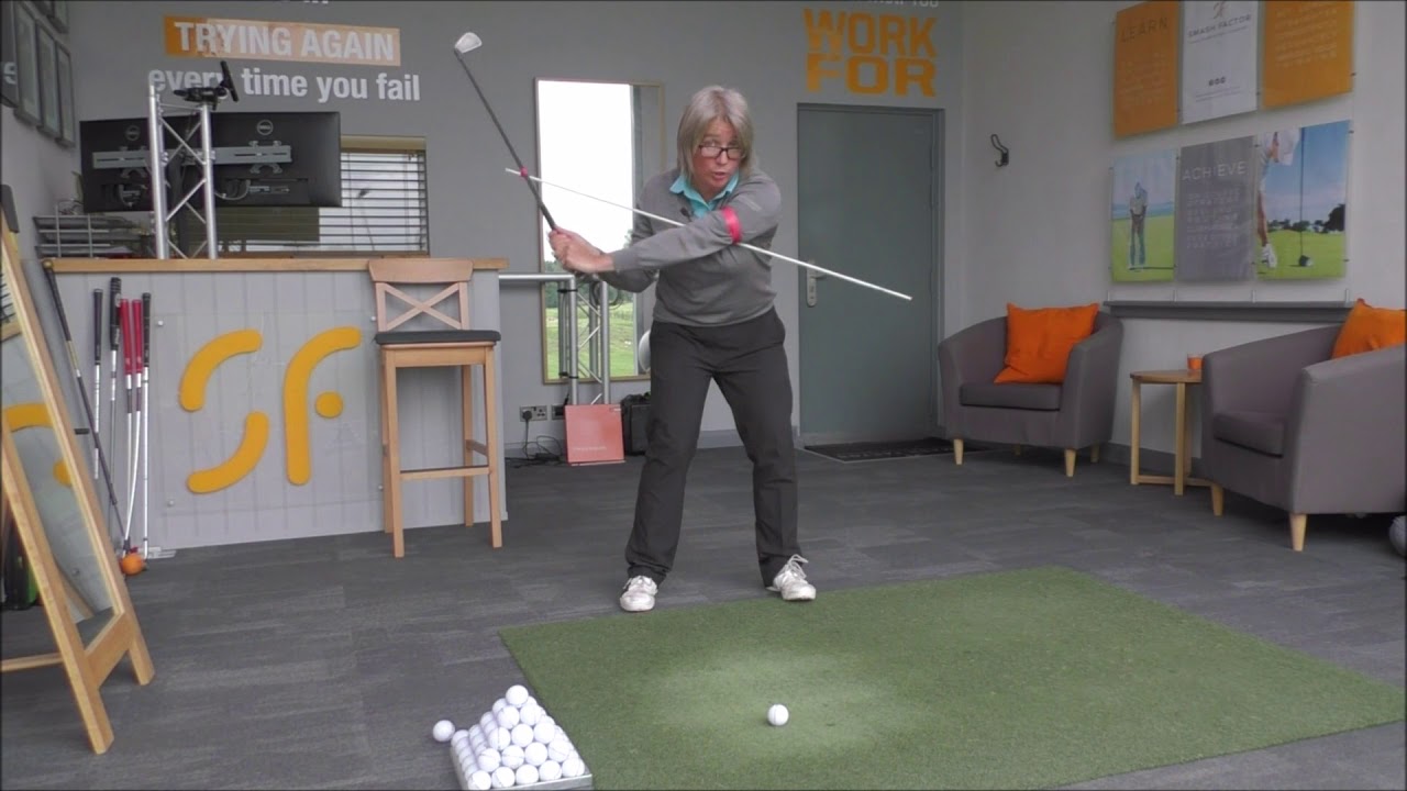 Rotate your body like a pro through impact for correct golf swing release