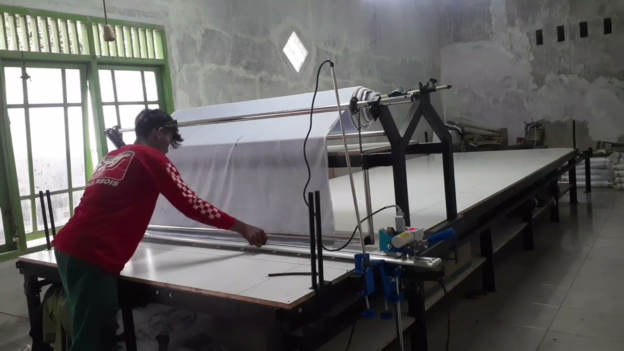 alat gelar kain manual