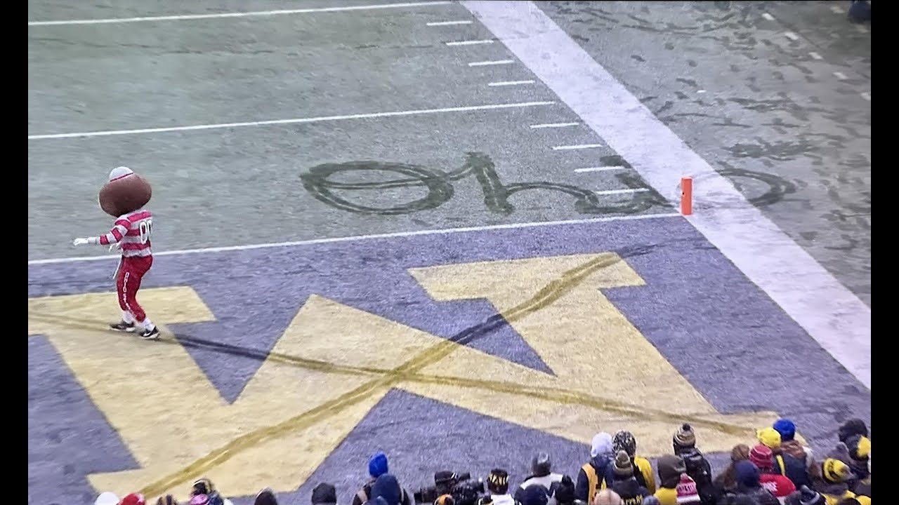 Brutus Buckeye does Script Ohio and crosses out the M in Michigan's end zone