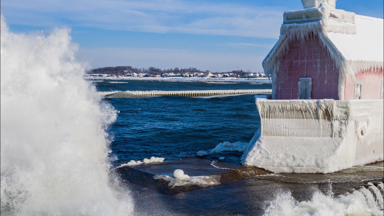 A Must See! Big Waves Crash Over Frozen Grand Haven Michigan Lighthouse 4K Drone Footage
