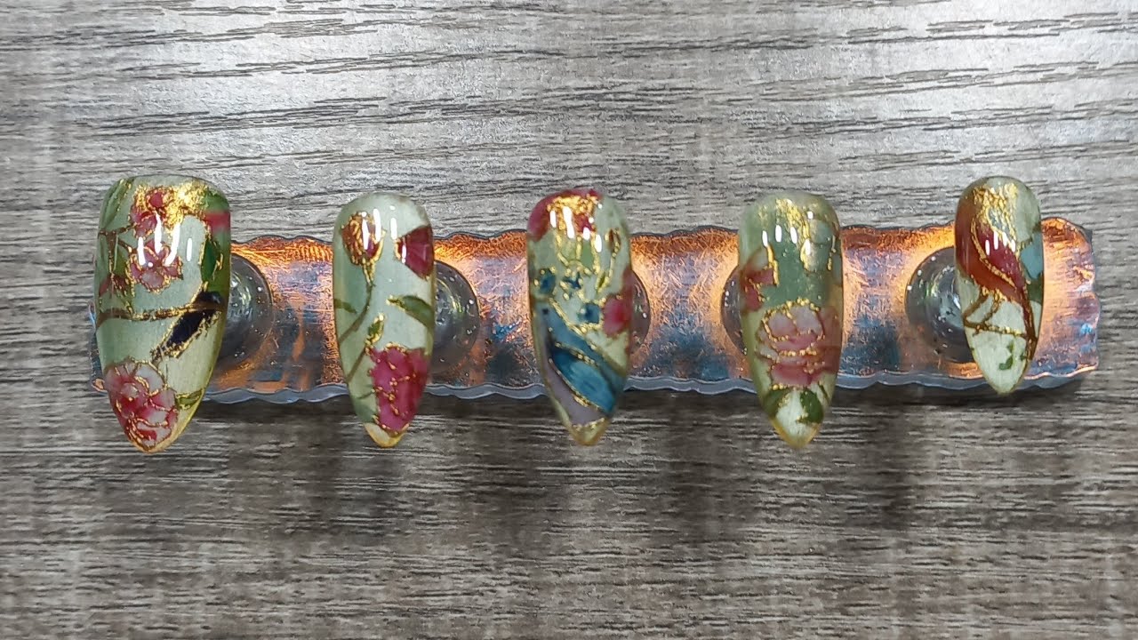 gilded bird and flower mani