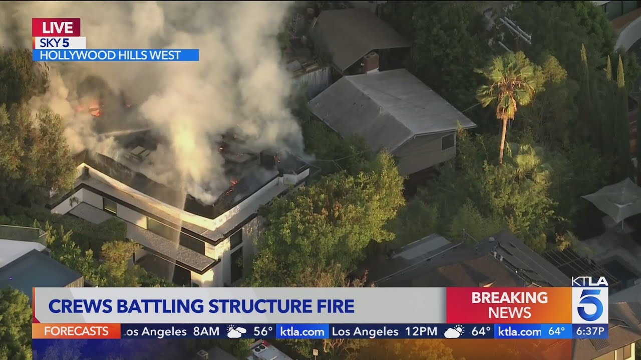 Crews battling large house fire in Hollywood Hills