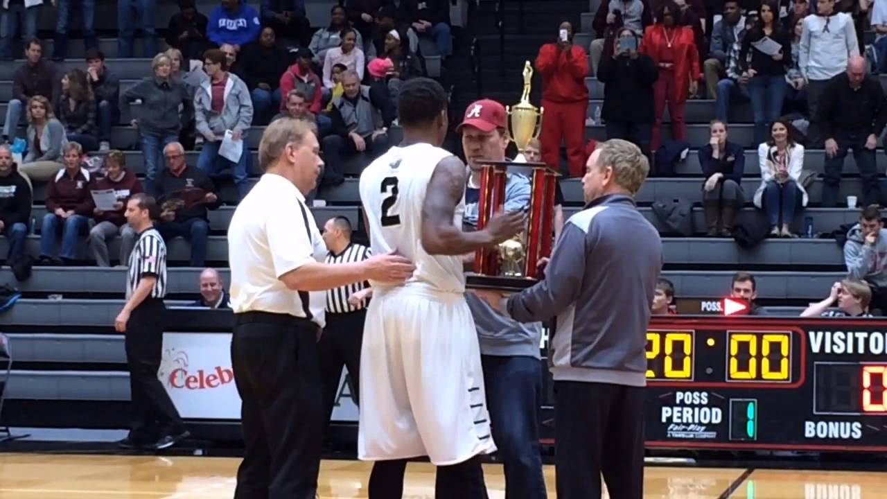 Davenport University's Dominez Burnett is honored prior to Wednesday's Champions of Character All-St