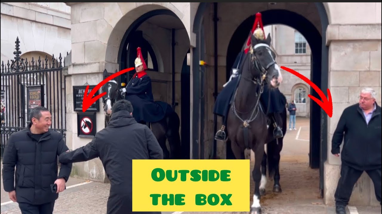 OUTSIDE THE WHITE BOX The strict guard warned the tourists twice as they entered inside.