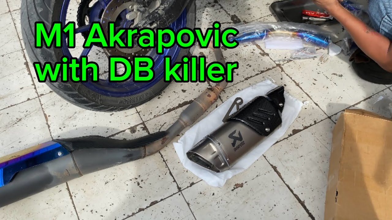 Installing aftermarket Exhaust. Akrapovic M1, Silver laser print Exhaust, titanium blue pipe.