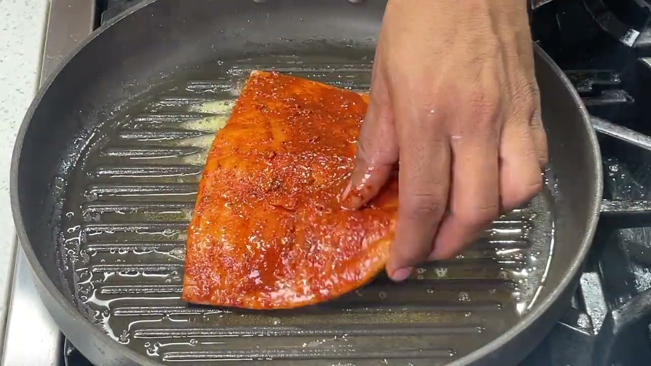 A salmon filet with creamy mushroom sauce