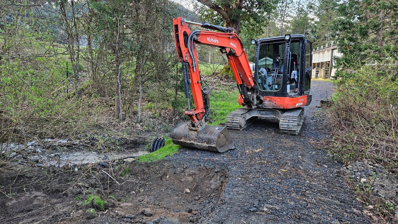 Fixing a sink hole with the Kubota KX 040 4