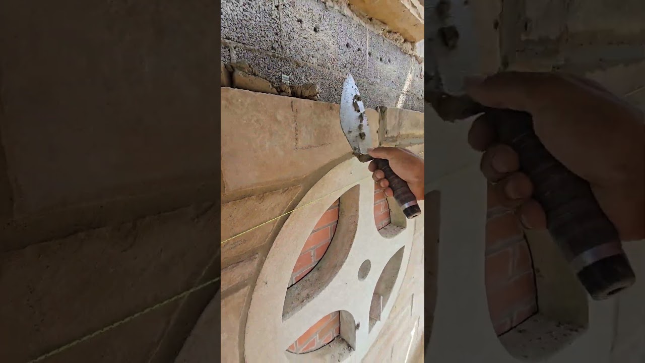 stiffer than normal mortar cement is spread for the bed joint so it can hold the heavy sandstone