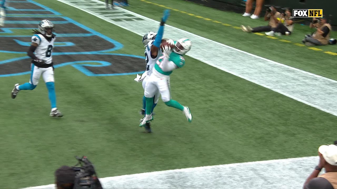 DeVon Achane MOSSES the defender for the touchdown