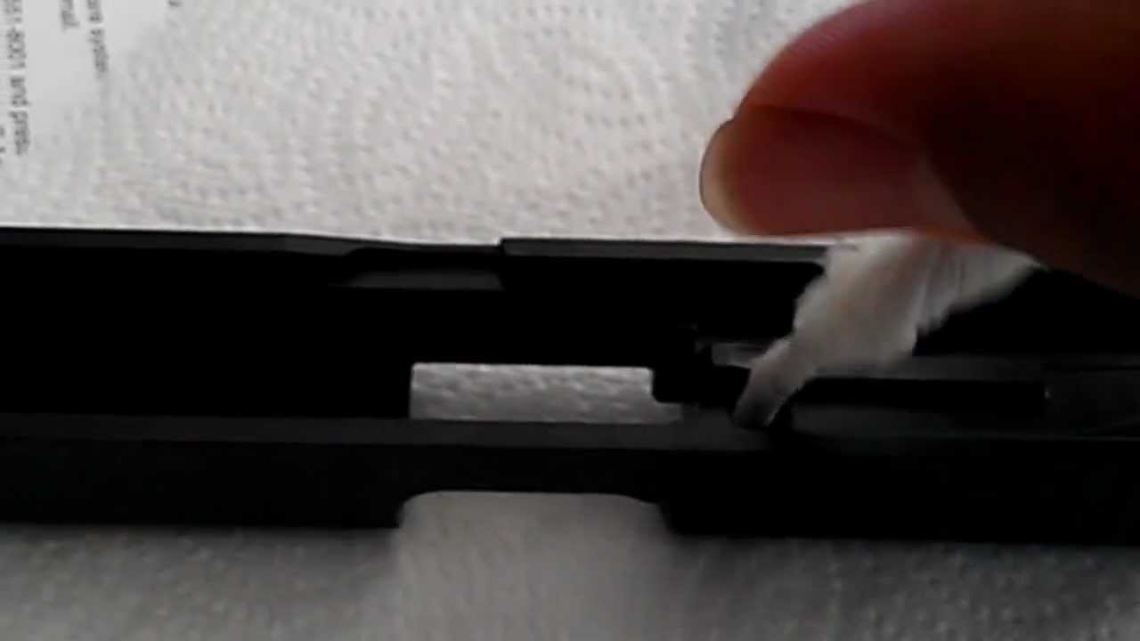 Cleaning the holes or ports of a Glock Slide