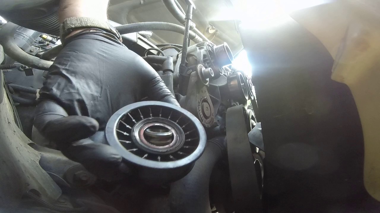 how to replace belt tensioner pulley on dodge