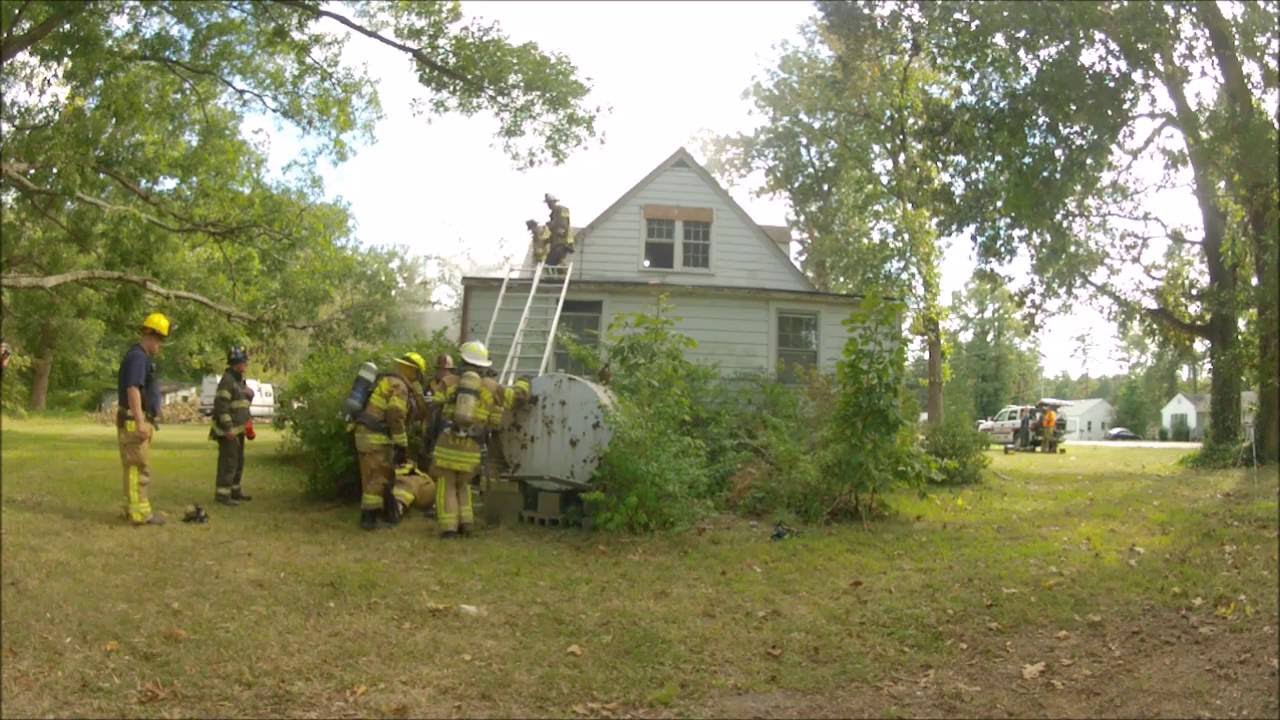 Task Force 1, Inc. - Downed Firefighter Removed From Roof Via Ground Ladders