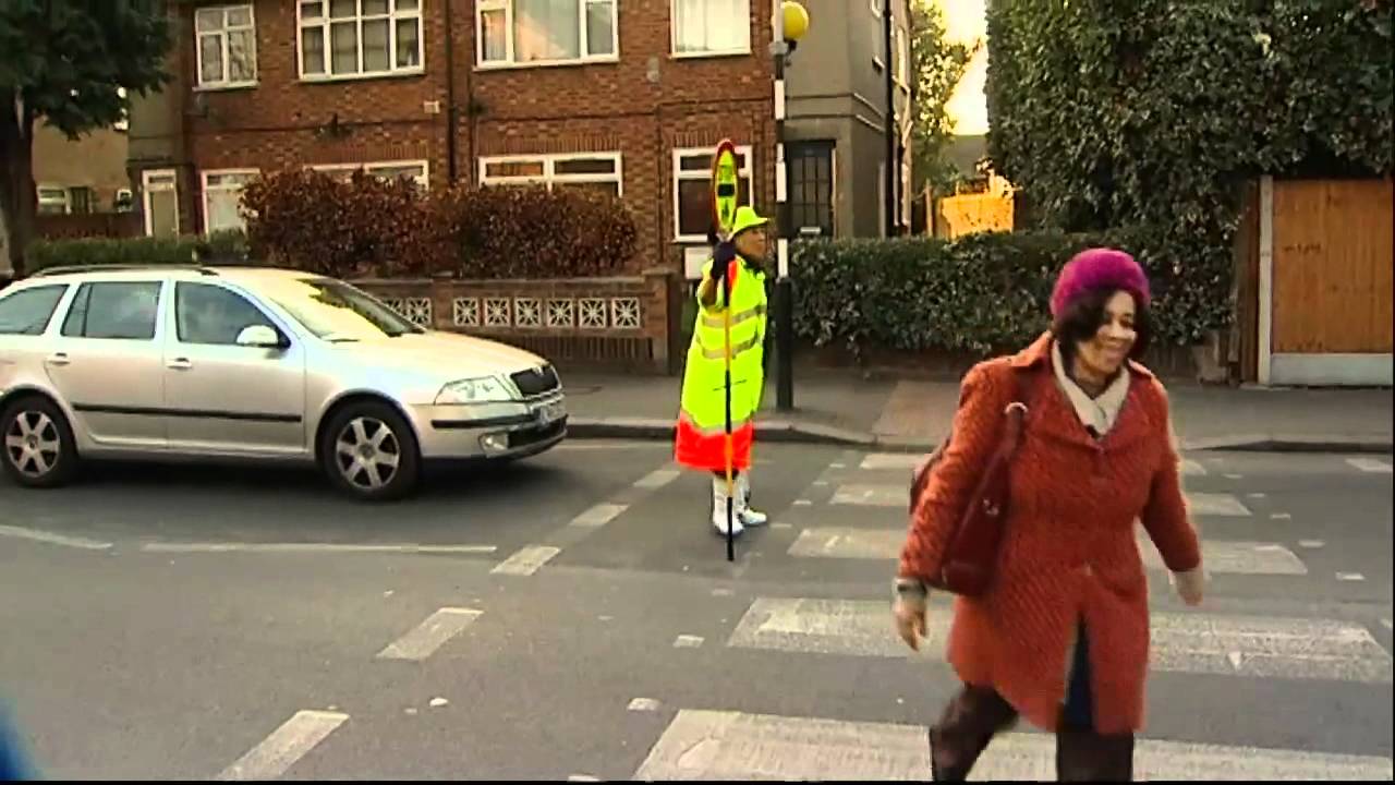 Dancing lollipop lady Arlene Cameron shows her fancy footwork at zebra crossing