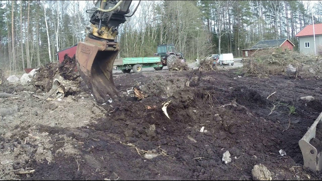 Volvo ECR88 digging some stumps