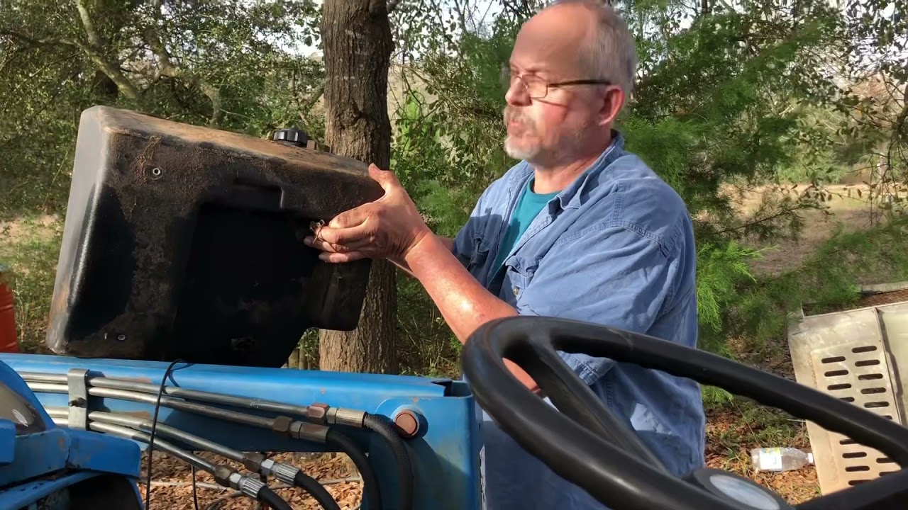 New Holland TC33 tractor, fuel tank removal and clean out. Baking soda and vinegar.