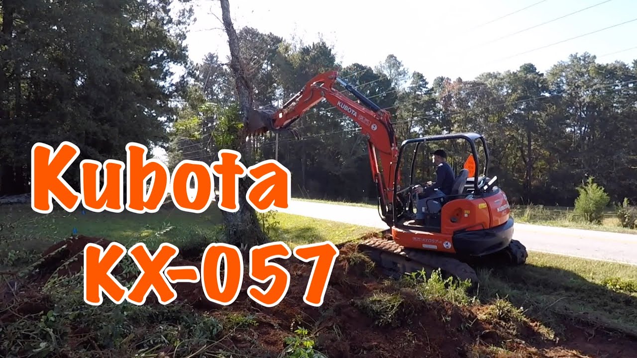 Knocking down trees and digging up stumps with a Kubota KX-057