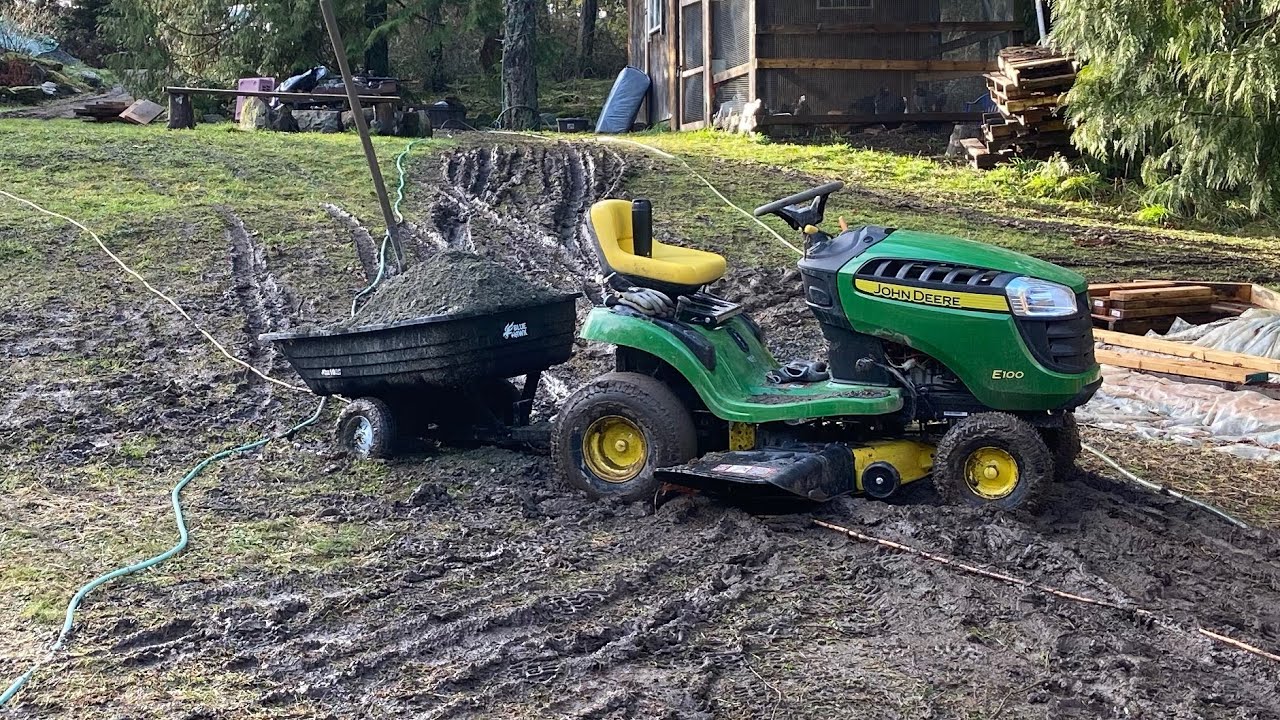 Hauling Crush for concrete with a John Deere E100 Lawn Tractor