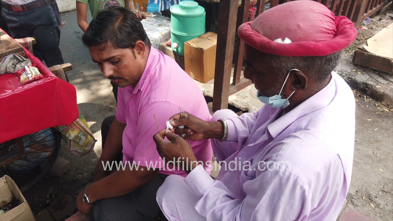 Ear Cleaners see business from men and not from women along India's streets: roadside hygiene