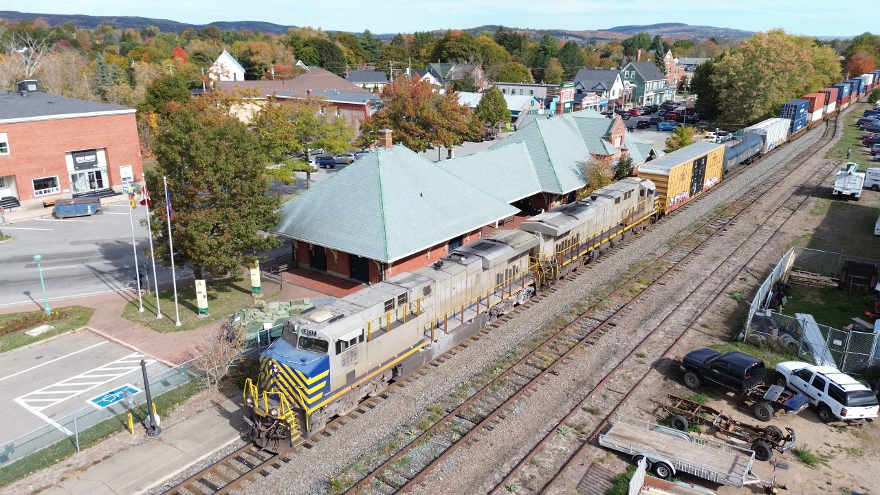 Awesome Aerial 4K View! Freight Train CN 594 West passing Former Train Station at Sussex, NB