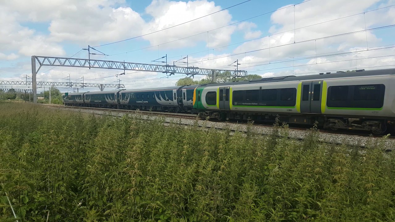 Superb class 92 + Mk5 coaches speed through SJ field in Norton Bridge on the last day of June 2019