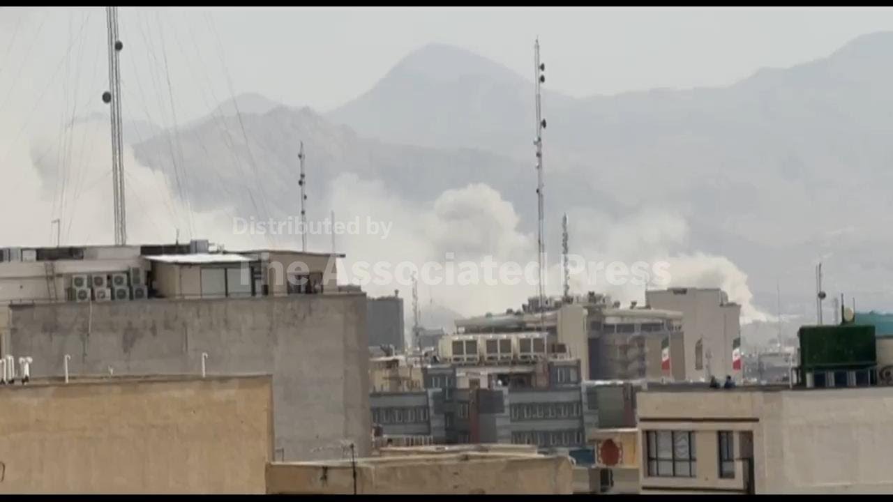 White smoke billows skywards in eastern Tehran as US and Israel launch major attack