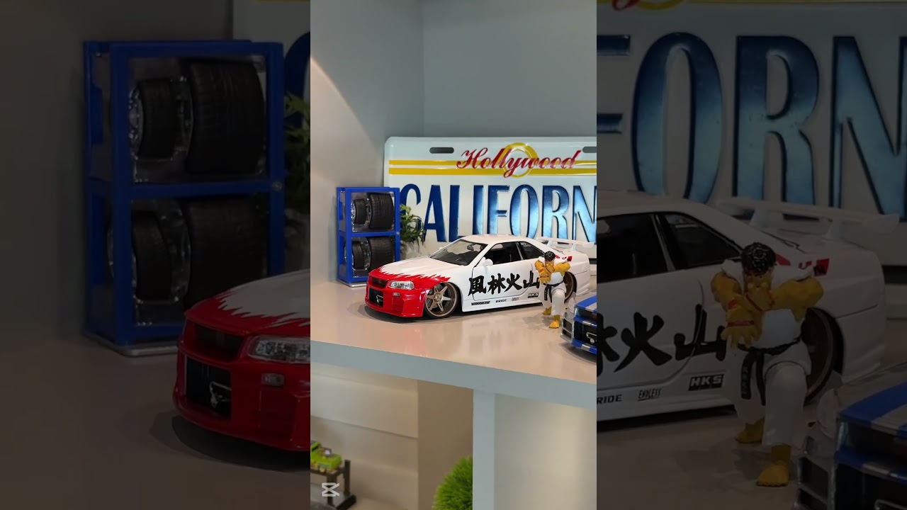 Miniatura Nissan Skyline GT-R R34 2002 - C/ Boneco Ryu - Street Fighter - Jada Toys - 1/24