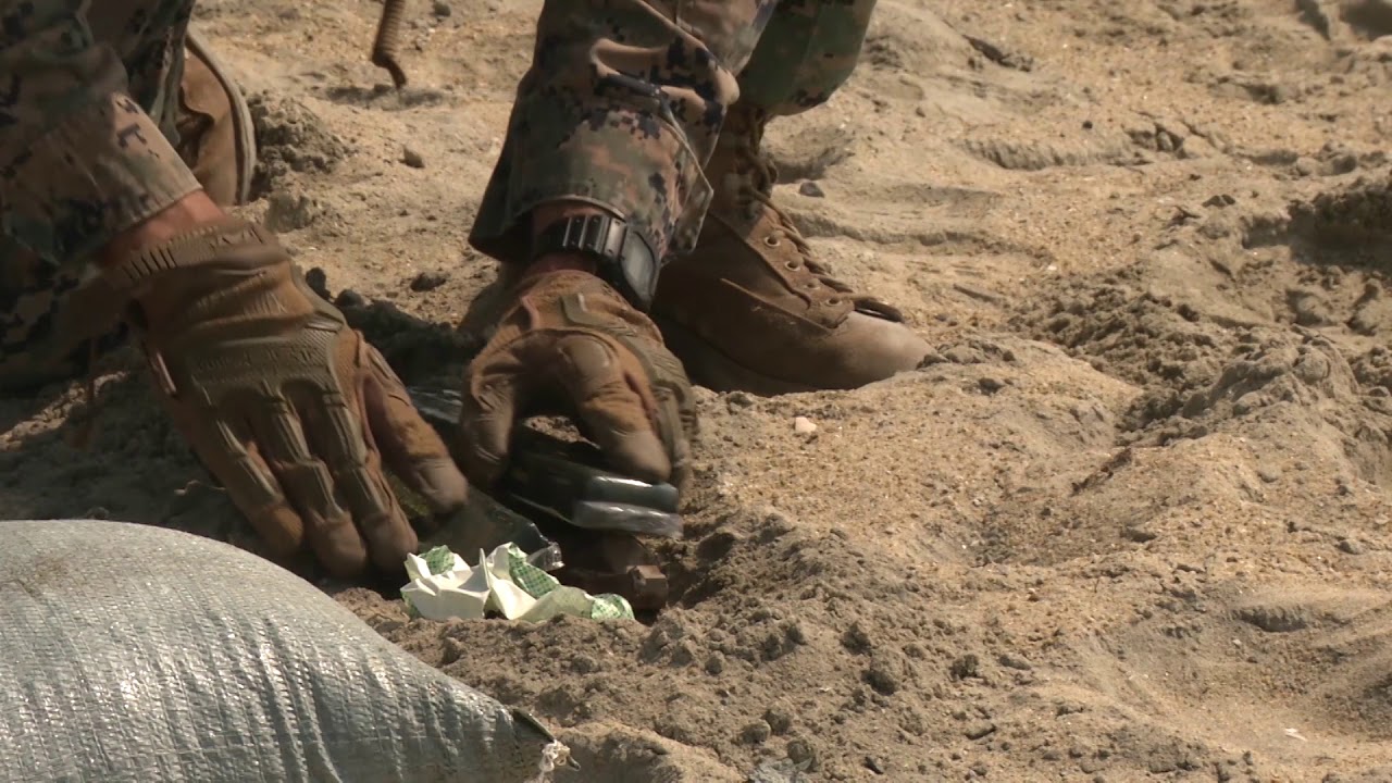 Explosive ordnance Marines detonate C4 to dispose of volatile material