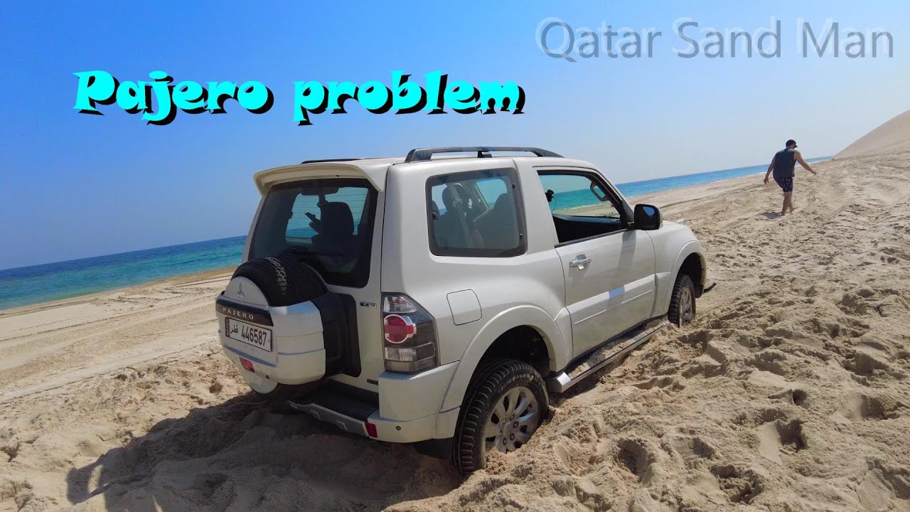 Mitsubishi Pajero stuck in sand on the beach of the Arabian Gulf. Sealine, Qatar.  سيلين , العديد
