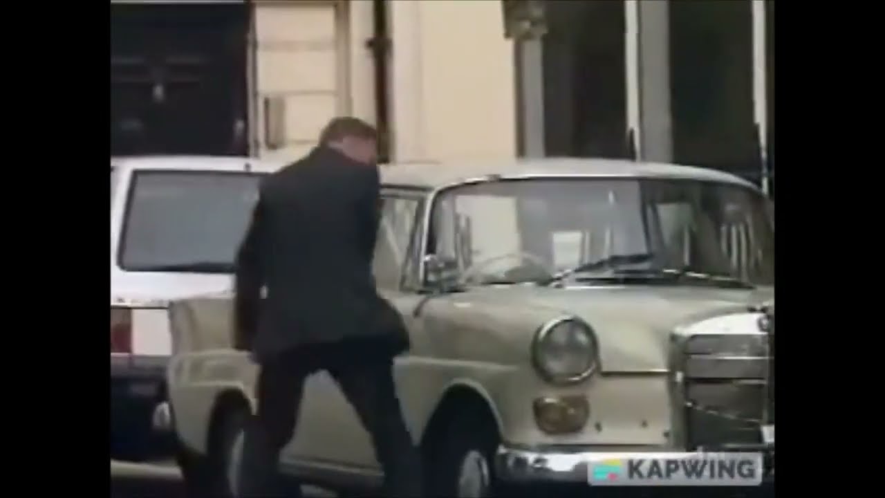 The Day Today - Angry politician punches car.