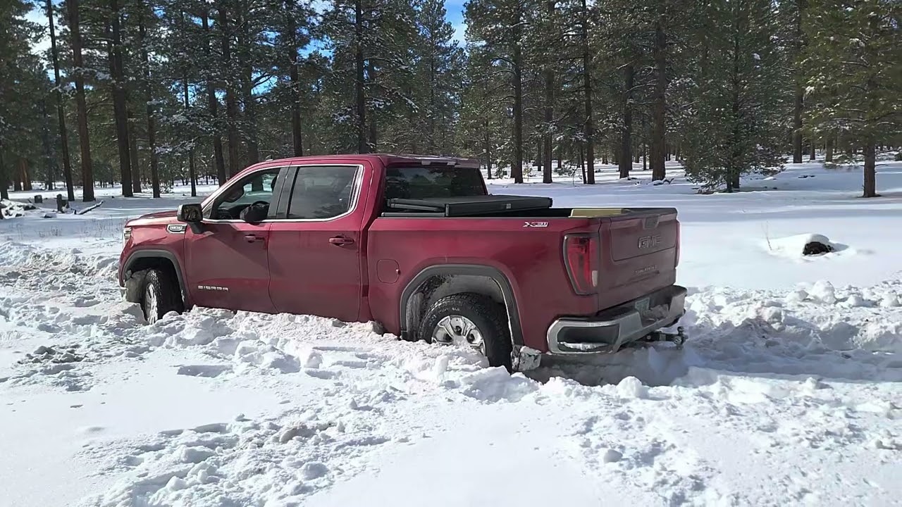 1500 GMC Sierra in deep snow