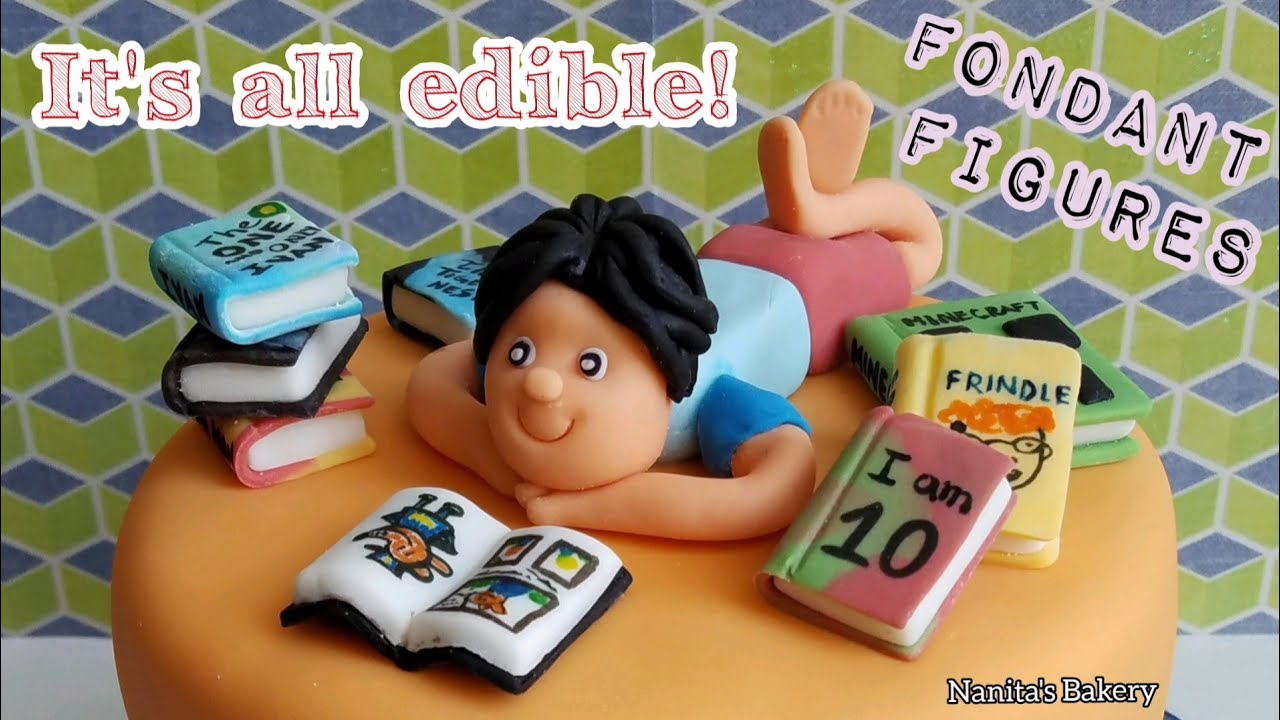 Boy + Books Fondant Cake Toppers  #lovetoreadcake #ediblelibrary #fondantbookscake #booklovercake