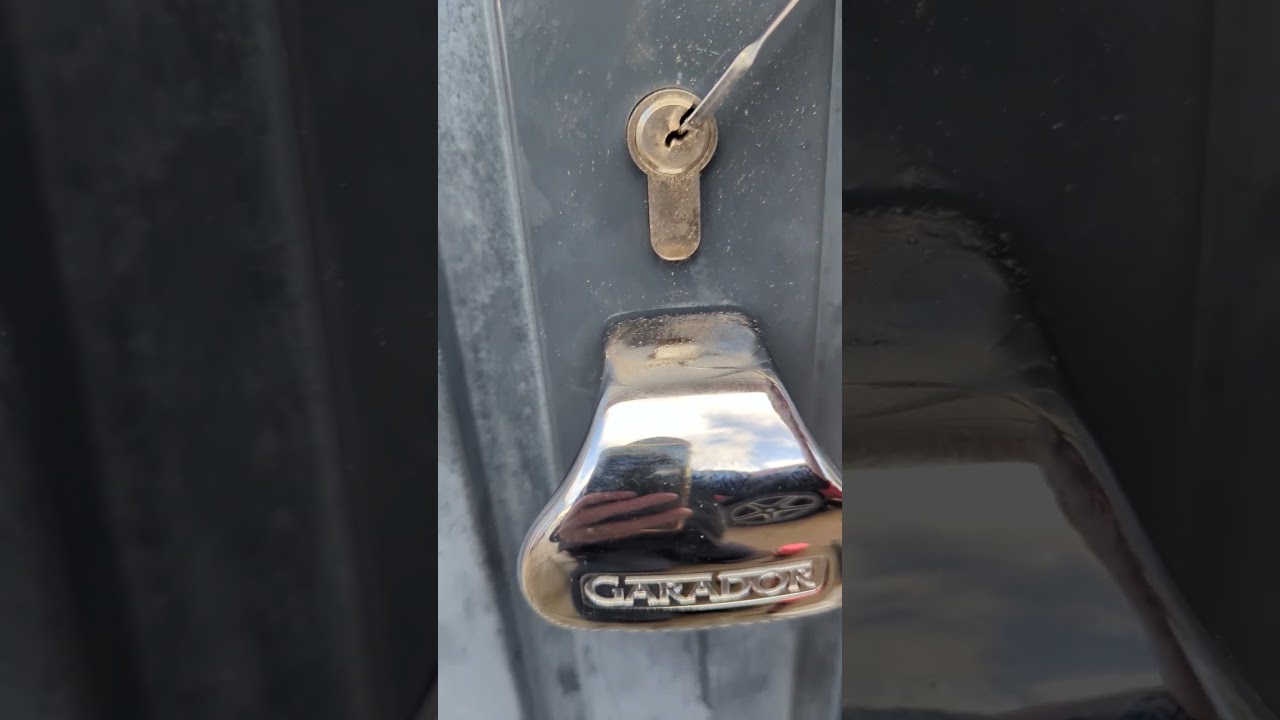 Garage door Euro cylinder lock picked open after keys were lost.