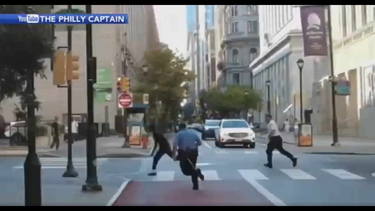 Video shows officer chase down suspect after gunfire sends visitors running in Center City