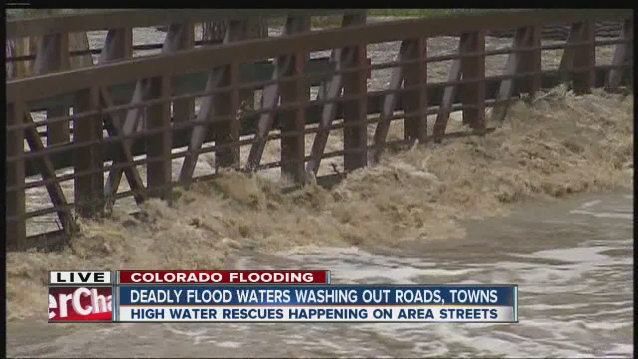 Deadly flood waters washing out roads, towns